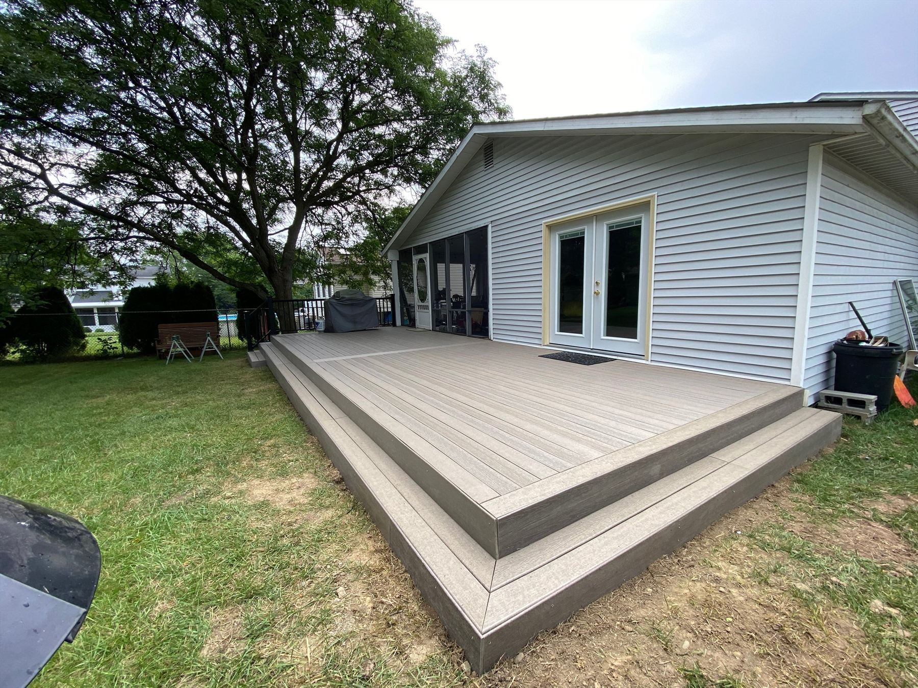 Low composite deck across the back of the house