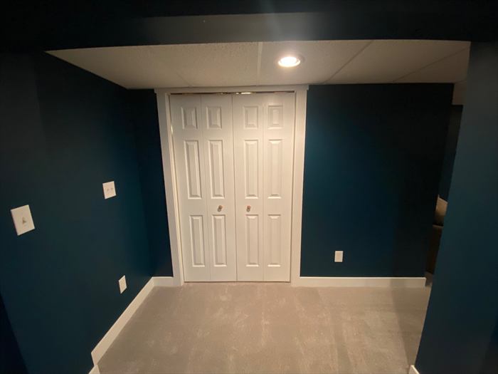 Closet doors and trim in the finished room