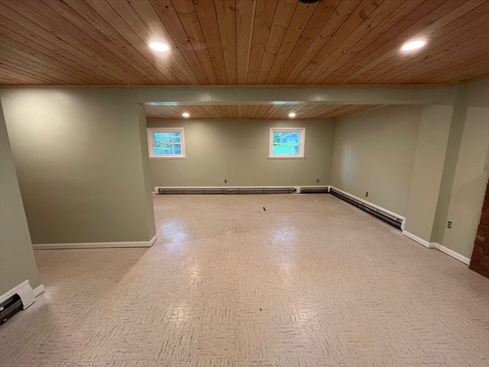 Recessed lighting across the finished ceiling