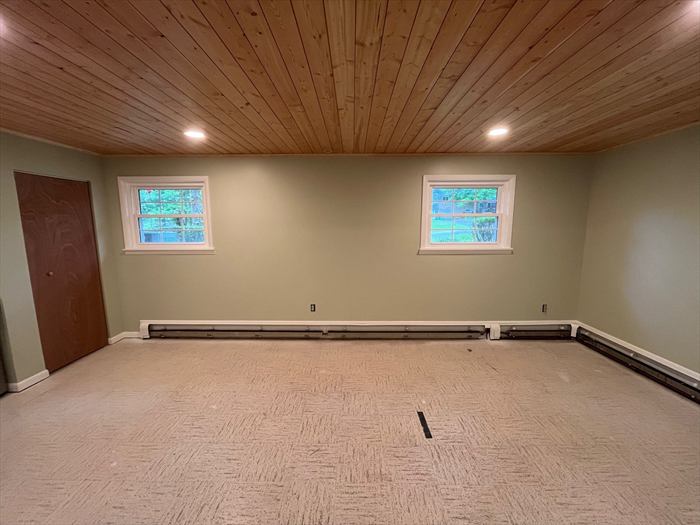 Back room with new carpet and windows