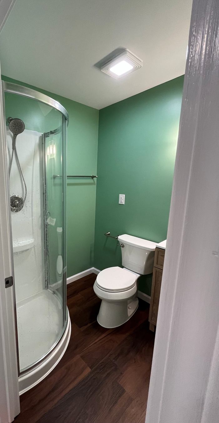 Corner shower and new toilet