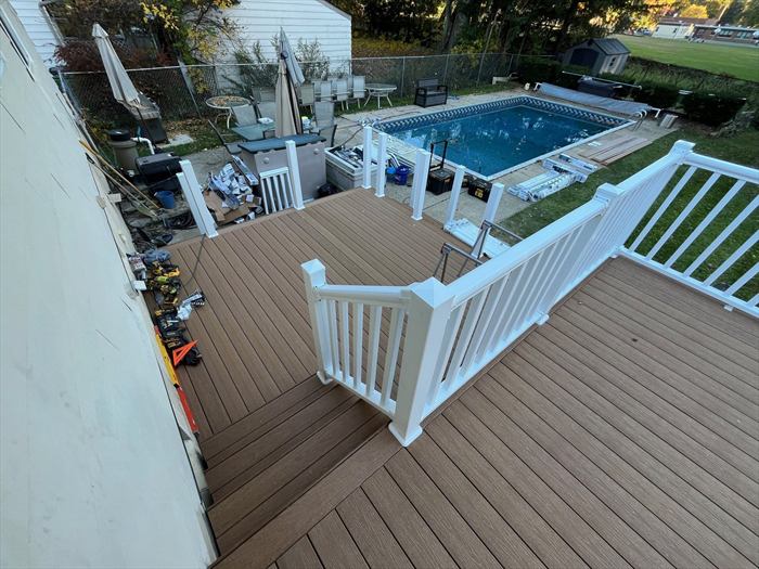 Deck and railing overlooking the pool