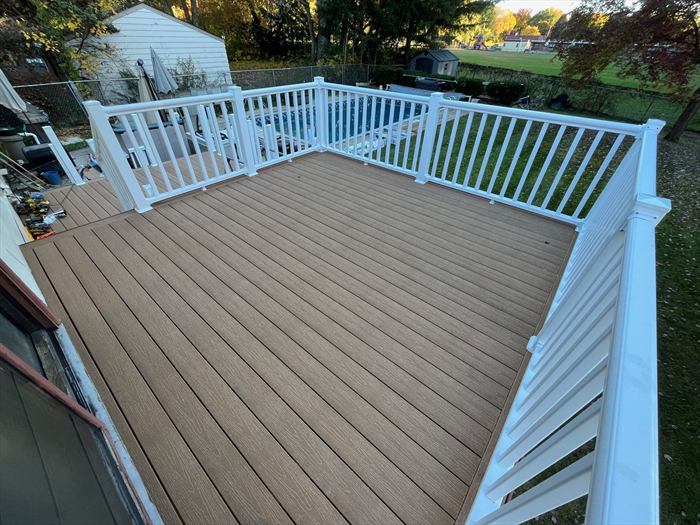 Brown composite decking with white railing