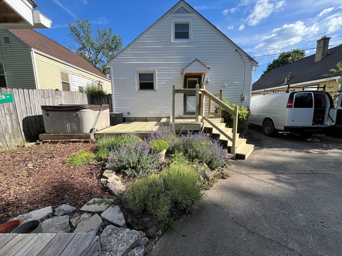 Steps and deck along the driveway side