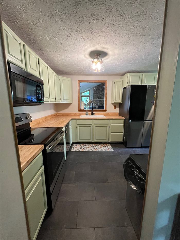Kitchen corner with black appliances